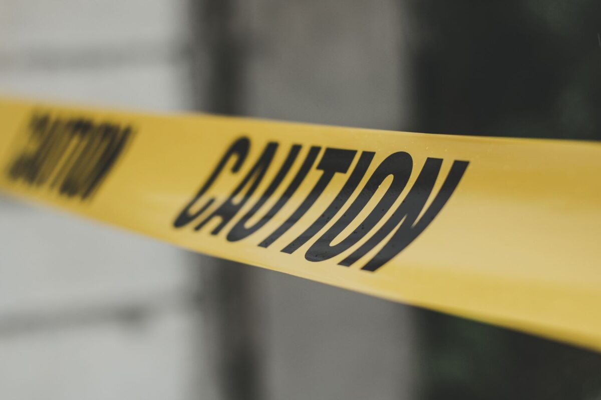 Yellow barricade caution tape close-up