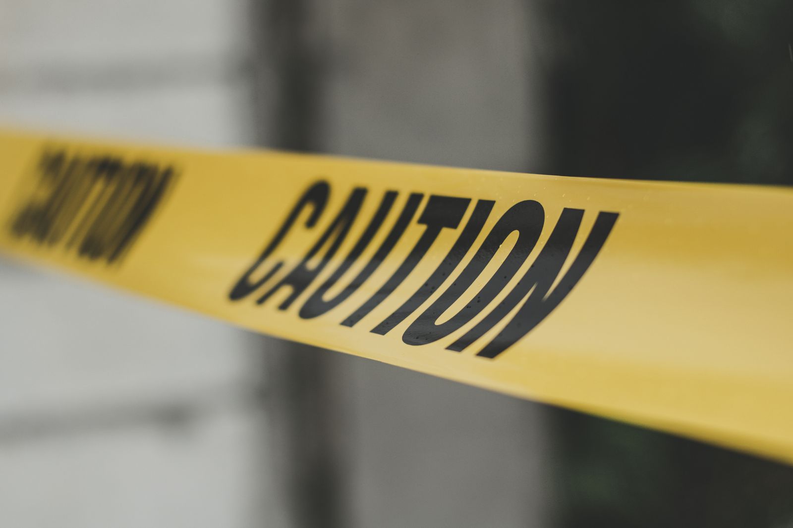 barricade-tape-photo Yellow barricade caution tape close-up