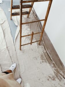 Renovation site with ladder and protected floor