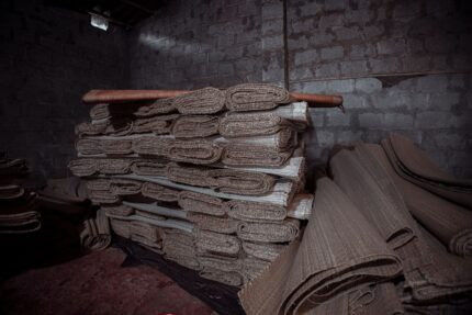 Rolls of protective fleece stacked in a warehouse