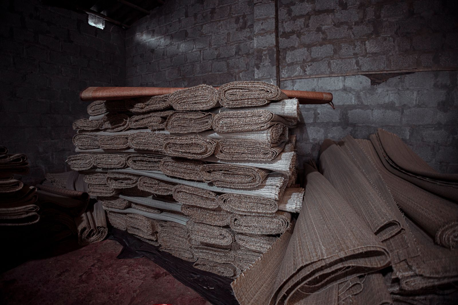 fleece-protection-photo Rolls of protective fleece stacked in a warehouse