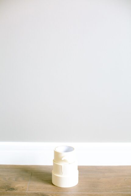 Stack of masking tape rolls on a wooden floor