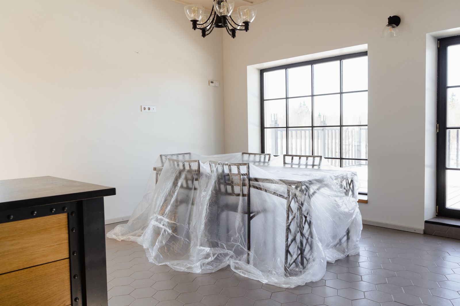 surface-protection-film-photo Dining room furniture covered with surface protection film during renovation