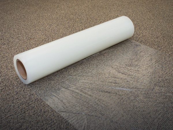 Carpet protection film applied on a carpeted staircase during renovation